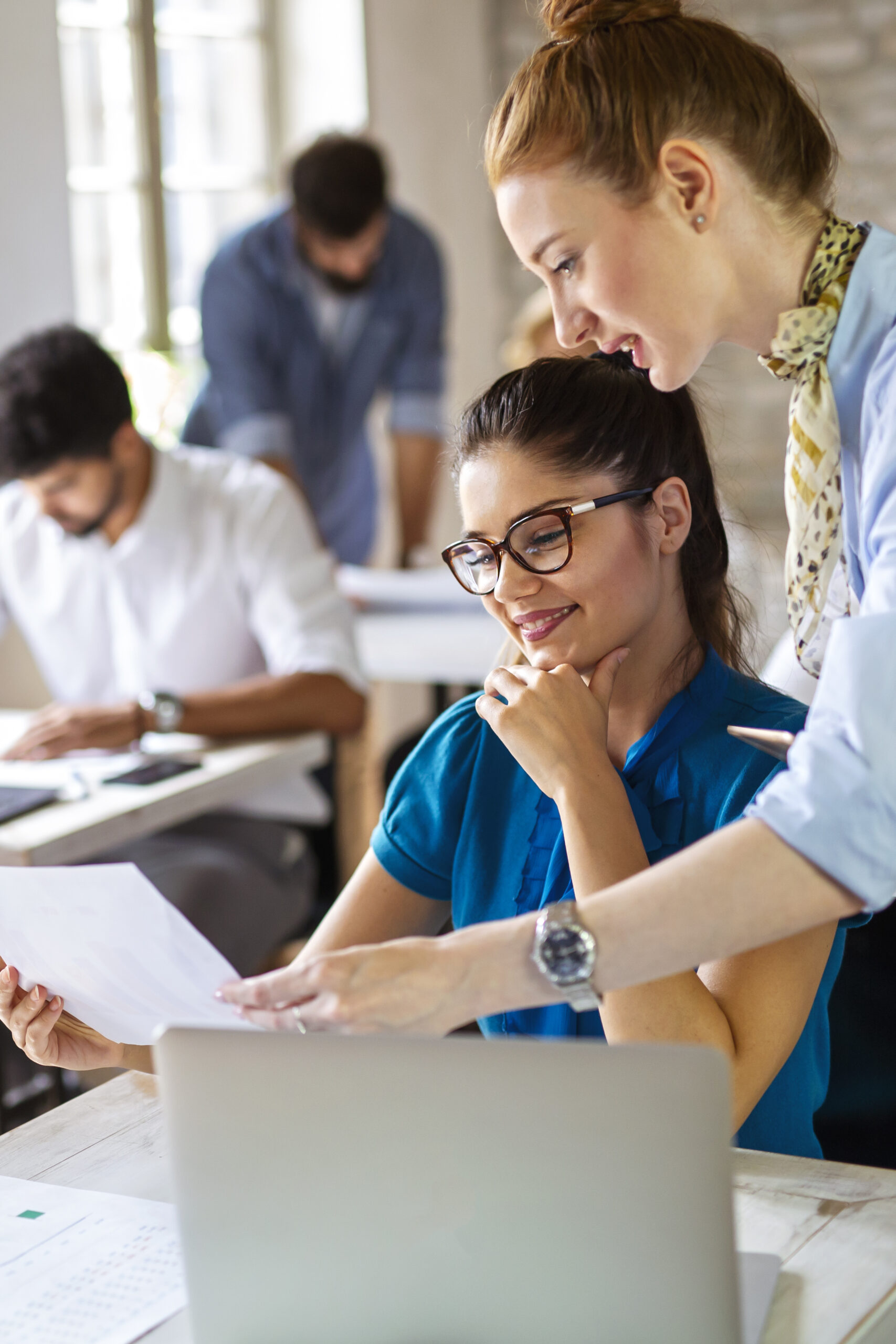 A student and adviser reviewing an application